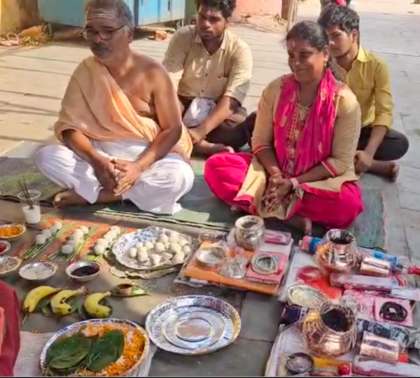 Devotees performing Tripindi Puja rituals.