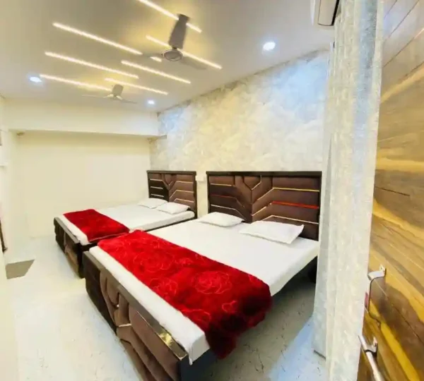 Guest house room with twin beds in Varanasi