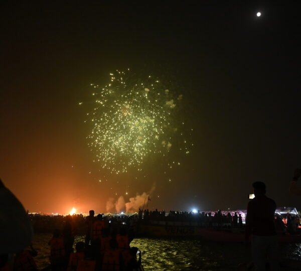 Fireworks lighting up the sky above the Ganges during Dev Deepawali in Varanasi