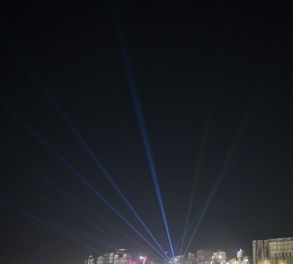 Illuminated ghats and evening atmosphere during a CNG boat ride in Varanasi