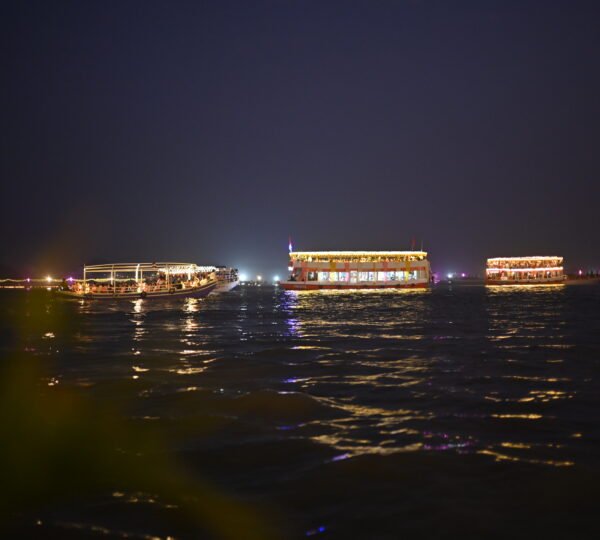 Tourists enjoying a private CNG boat ride for Ganga Aarti in Varanasi