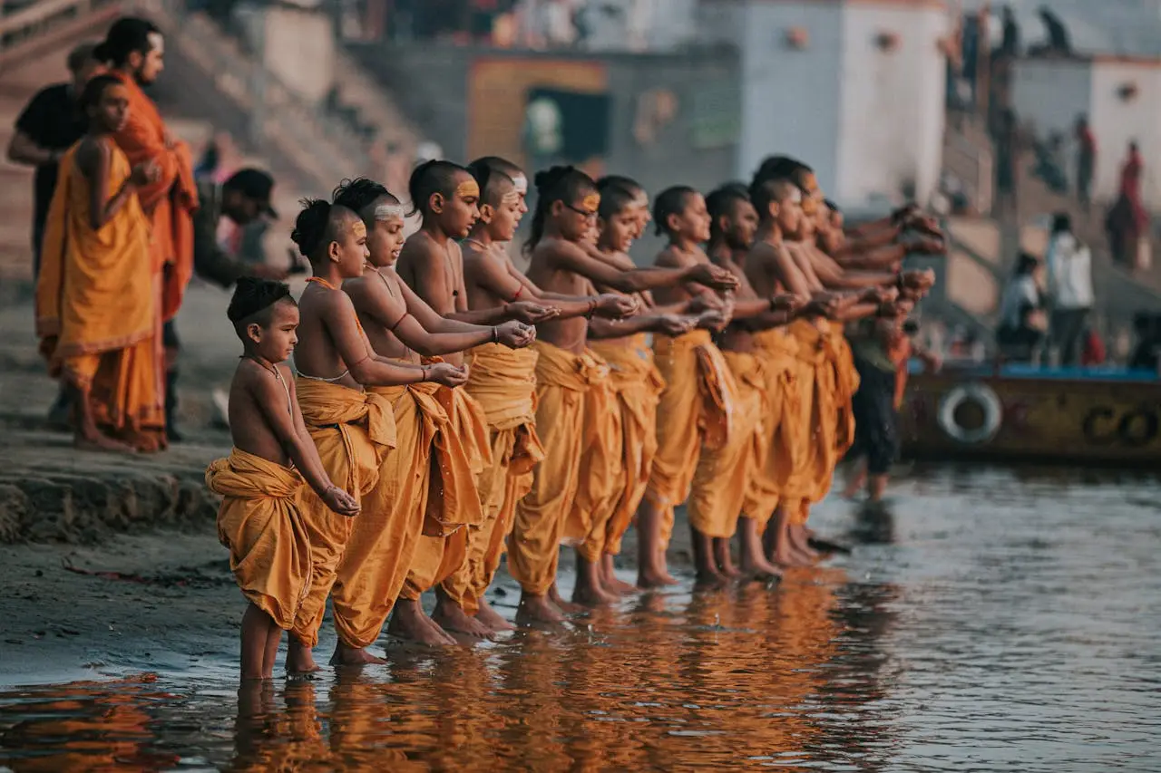 Young priests offering water rituals on Ganga Ghats in Kashi Varanasi.
