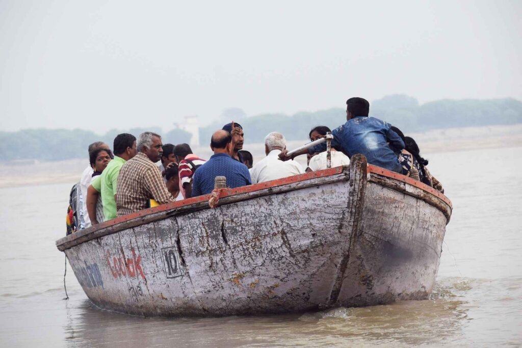 Devotees enjoying Ganga boat ride after boat booking in Varanasi during Dev Diwali