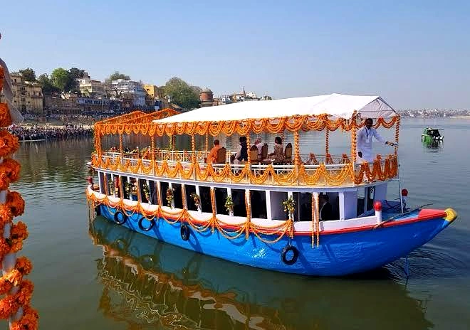 Traditional handcrafted Bajra boat sailing on the Ganges in Varanasi, offering a royal-style river cruise experience.